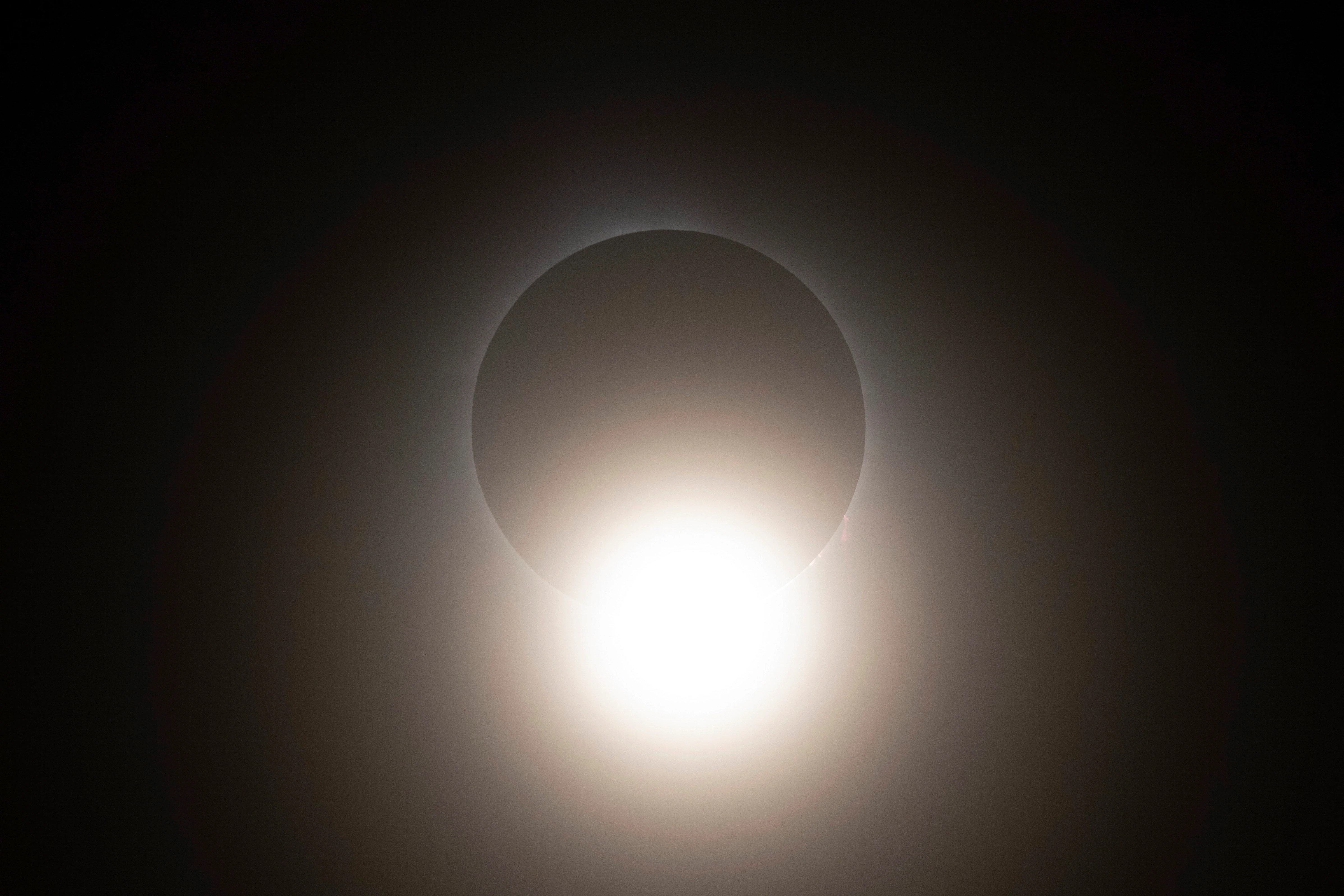 The moon partially covers the sun during a total solar eclipse seen from Progressive Field in Cleveland on Monday, April 8, 2024, before the Cleveland Guardians home opener baseball game against the Chicago White Sox.